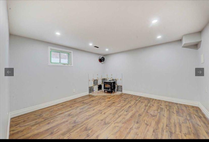 There is a fireplace in the corner of the room.
