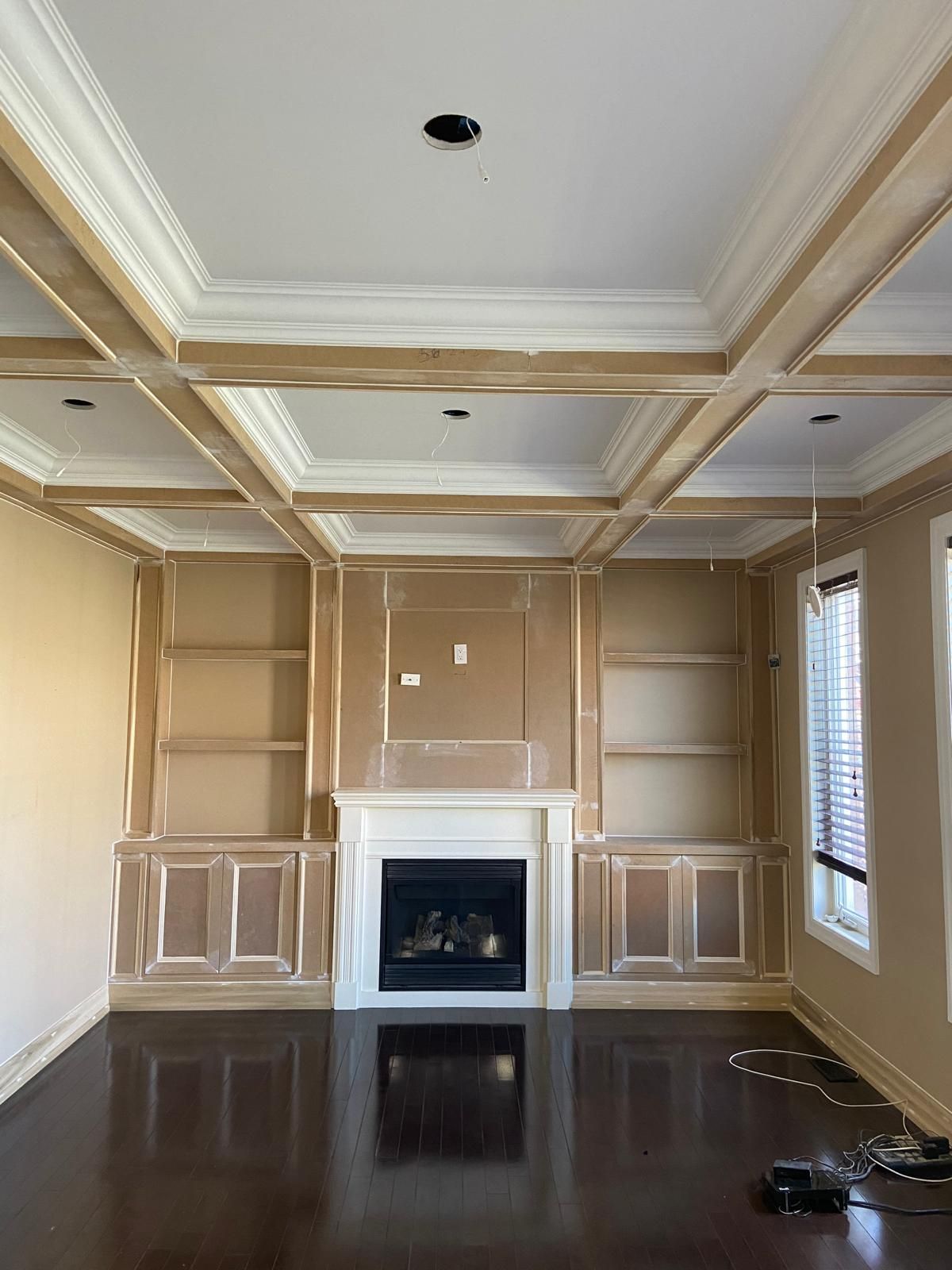 There is a fireplace in the middle of the room.