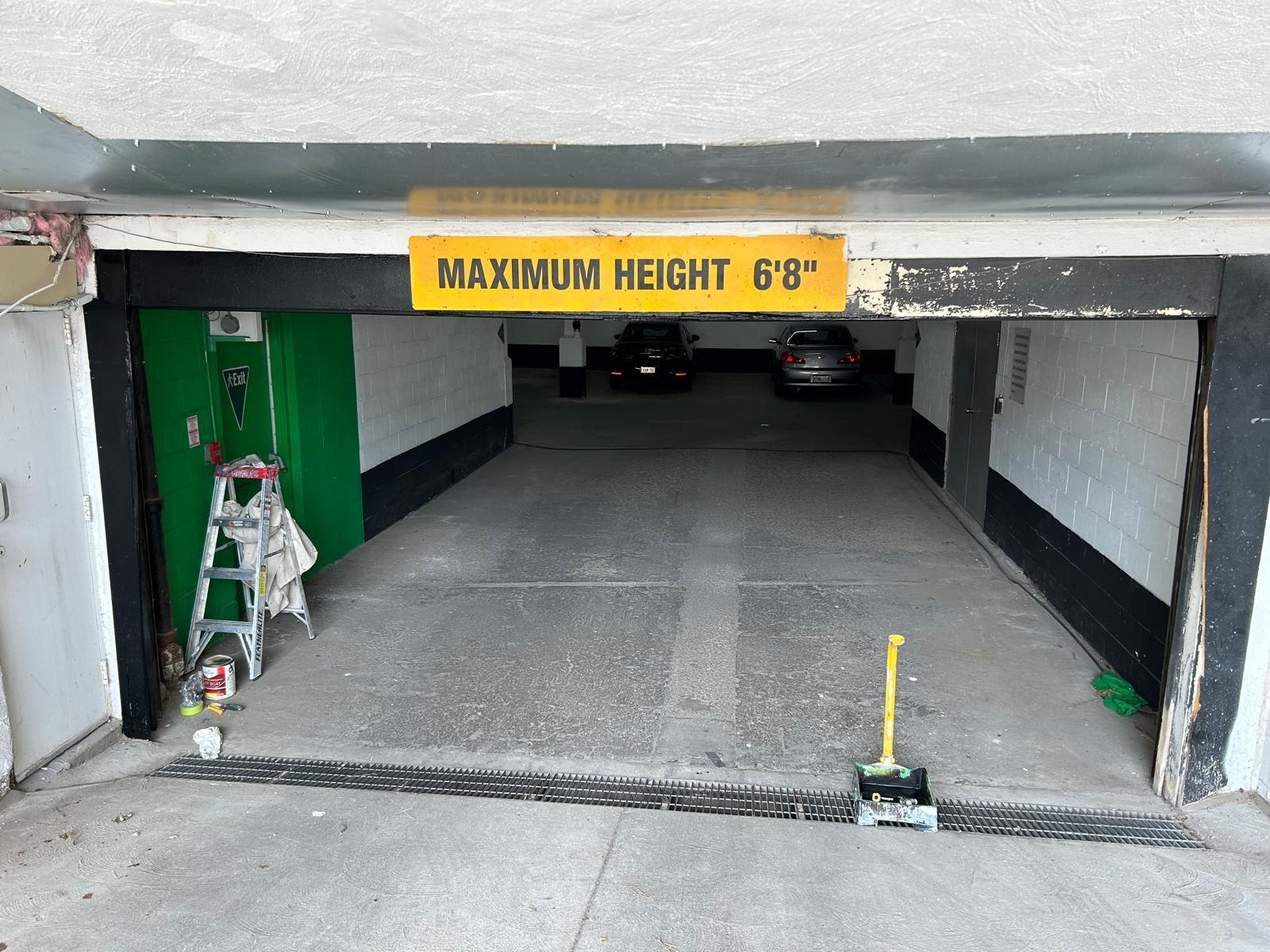 A garage with a sign that says maximum height 8 '8 '