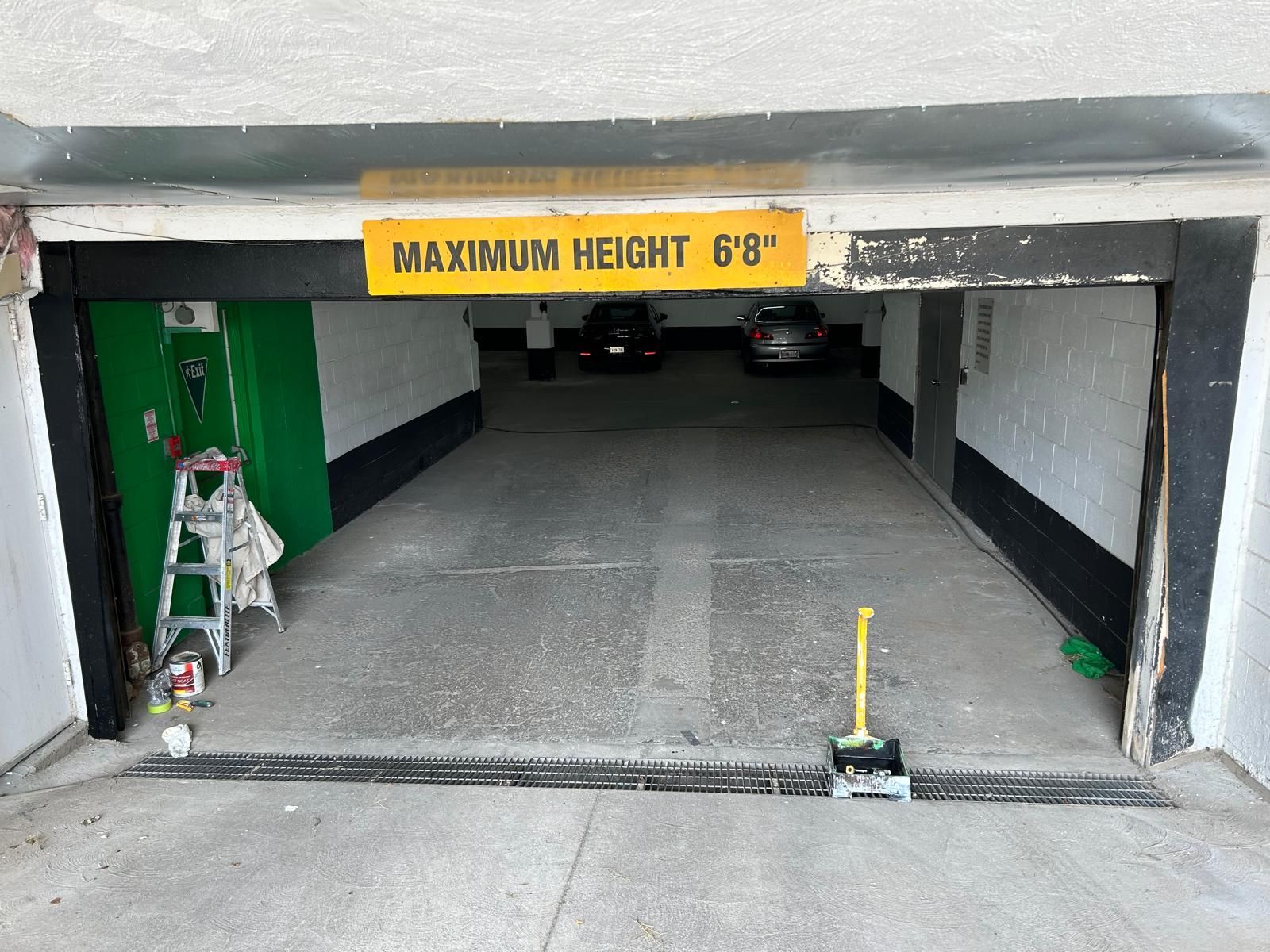 A garage with a sign that says maximum height 6 ' 8 '