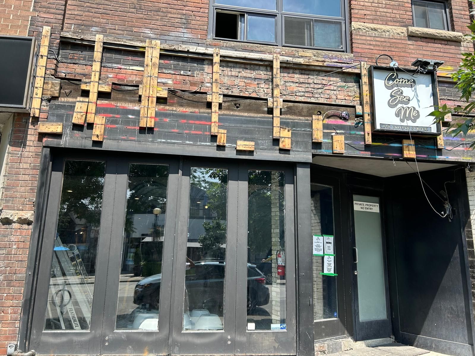 A brick building with a sign that says ' a ' on it