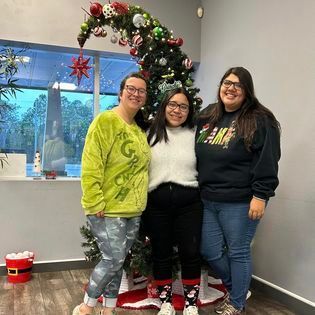 family with Christmas tree