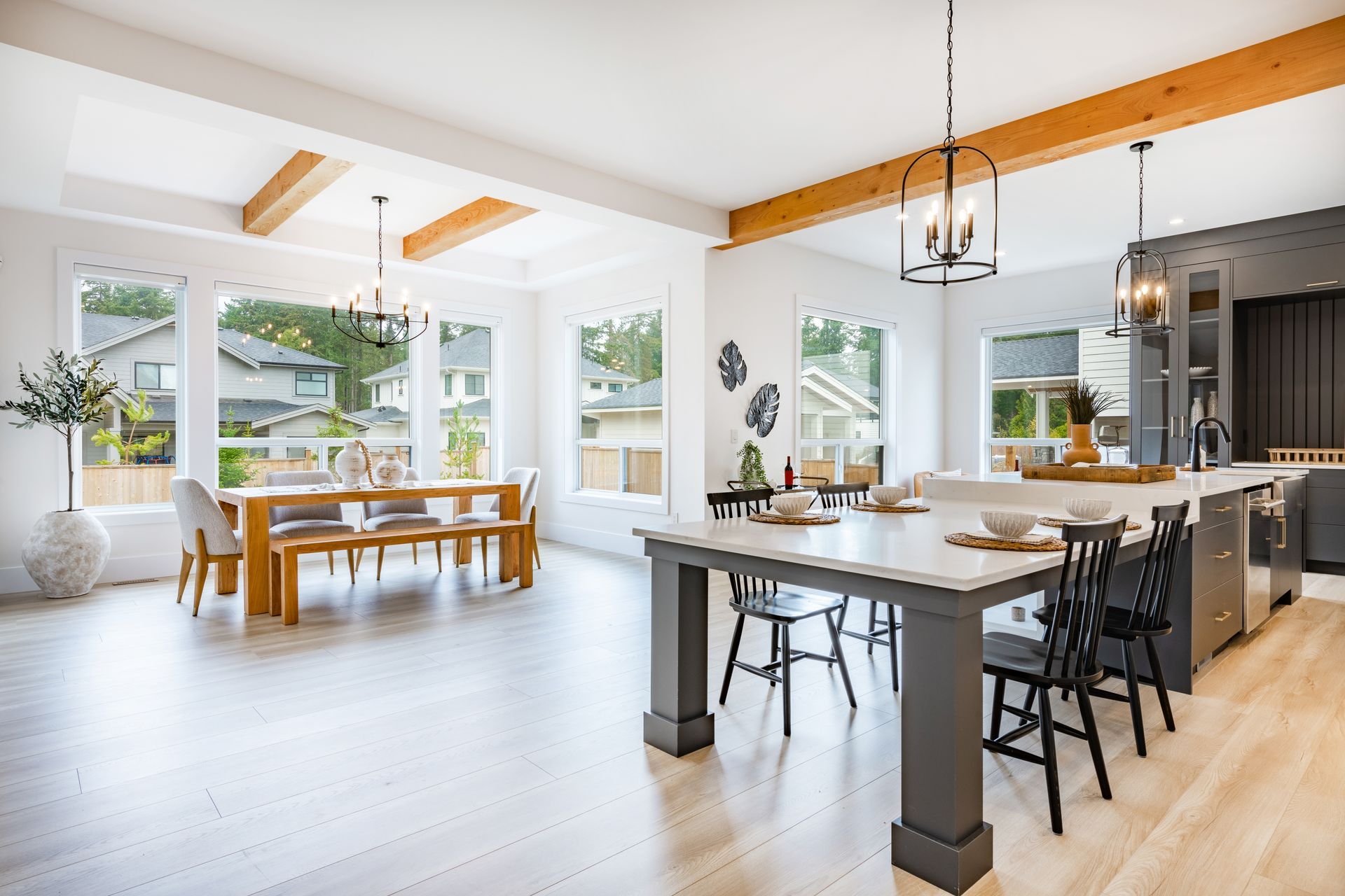 Bright, modern kitchen with island and dining table