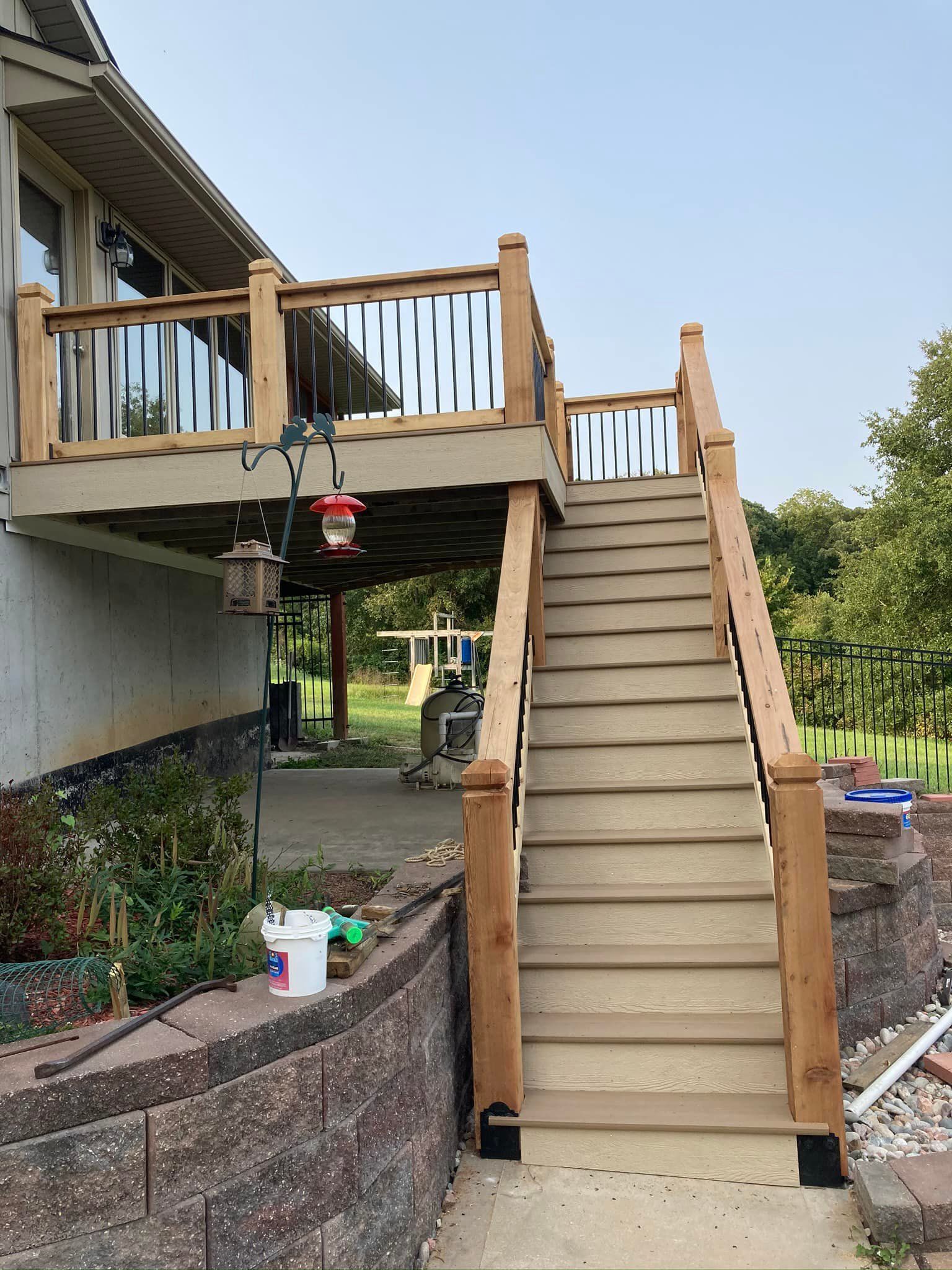 A wooden deck with stairs leading up to it.