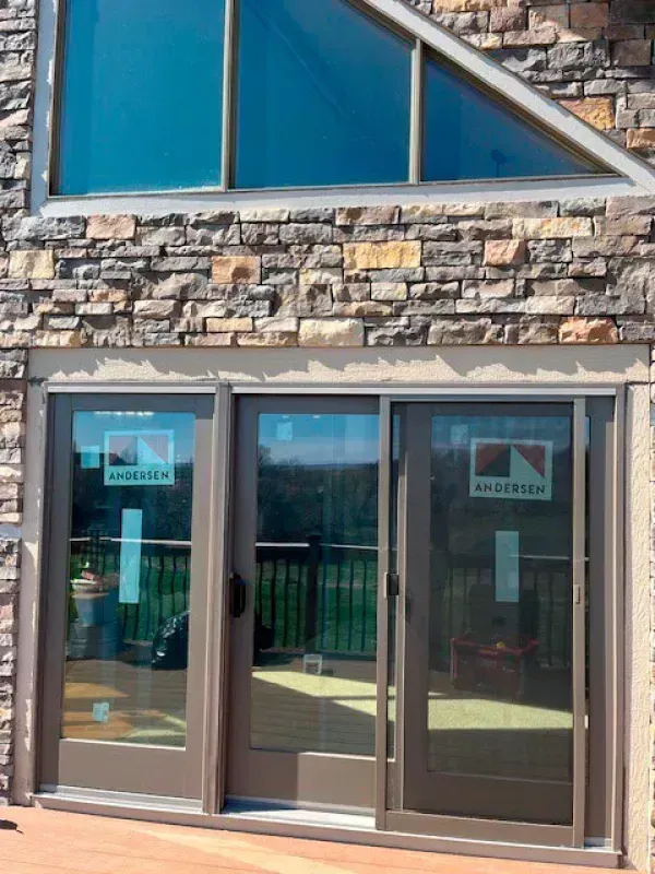 A sliding glass door on the side of a building