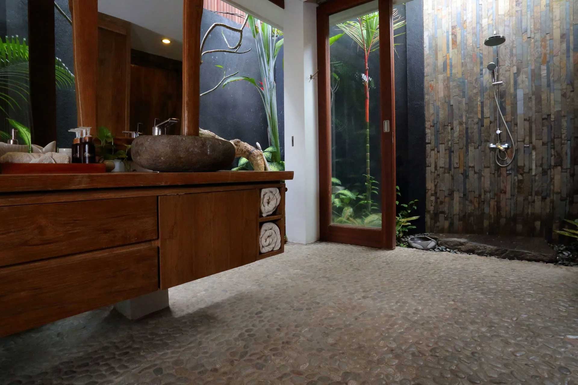 Outdoor Bathroom with Pebble Floor — Kauai, HI — Pacific Tile Imports