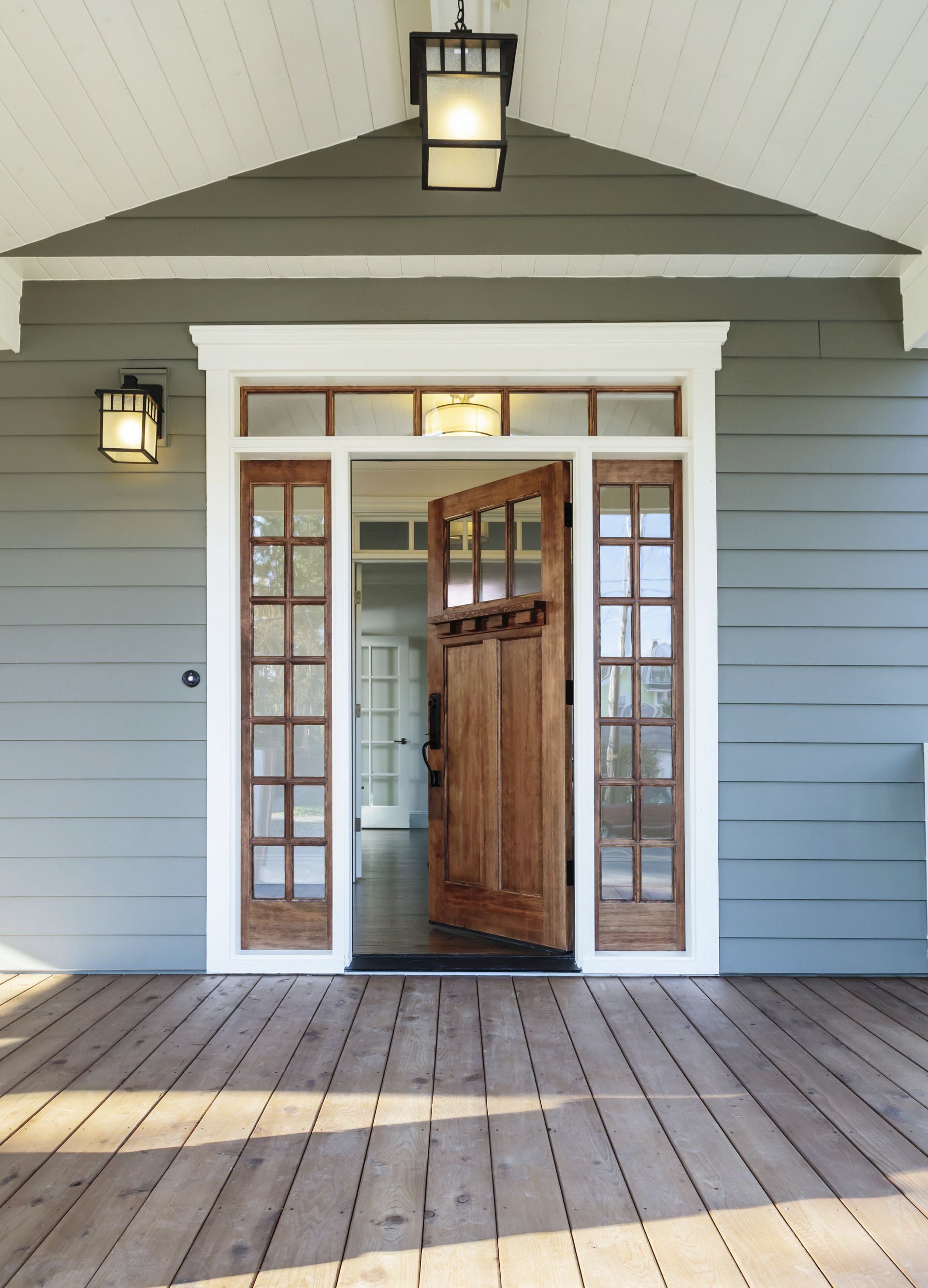 The front door of a house with a wooden floor