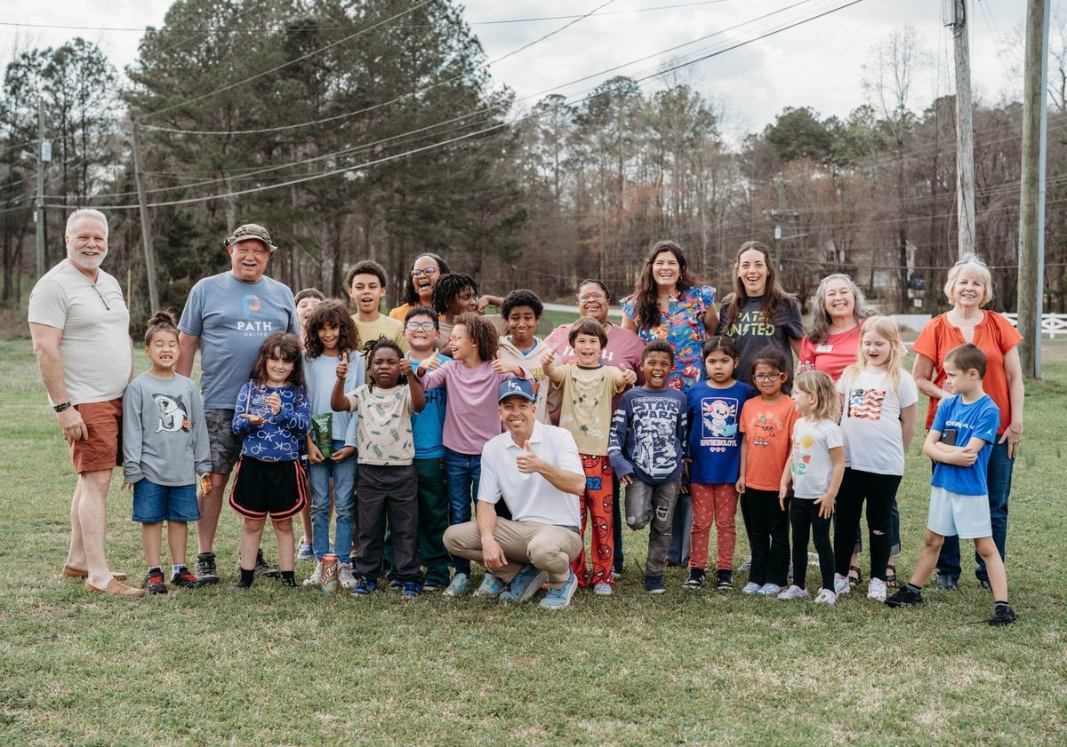 Kids, families and volunteers gathered on the lawn at the Auburn community
