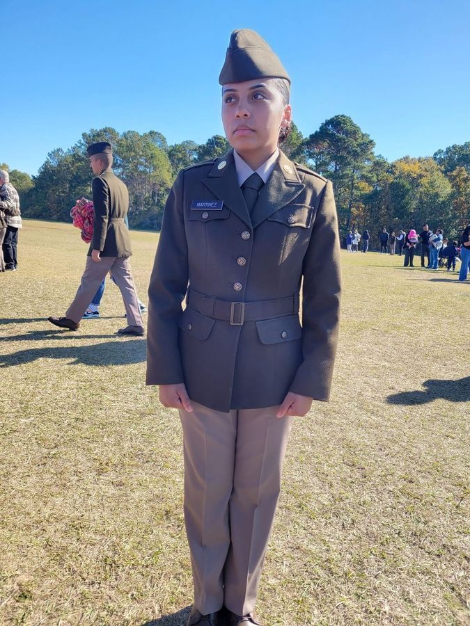 Yuneisi, a Path alumna, standing in her U.S. Army uniform