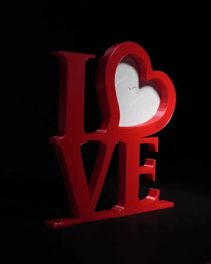 A red love sign with a heart in the middle