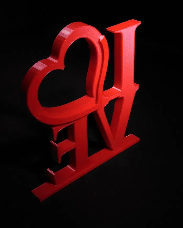 A red love sign with a heart in the middle