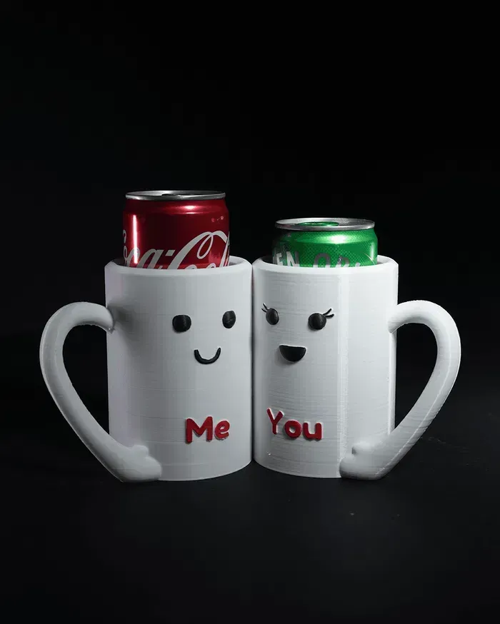 Two mugs with faces on them that say me and you