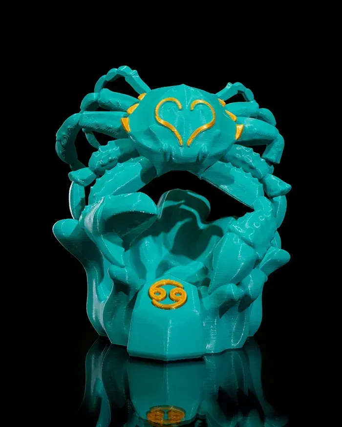 A turquoise crab with a yellow heart on its head