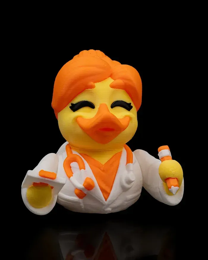 A rubber duck dressed as a doctor holding a stethoscope