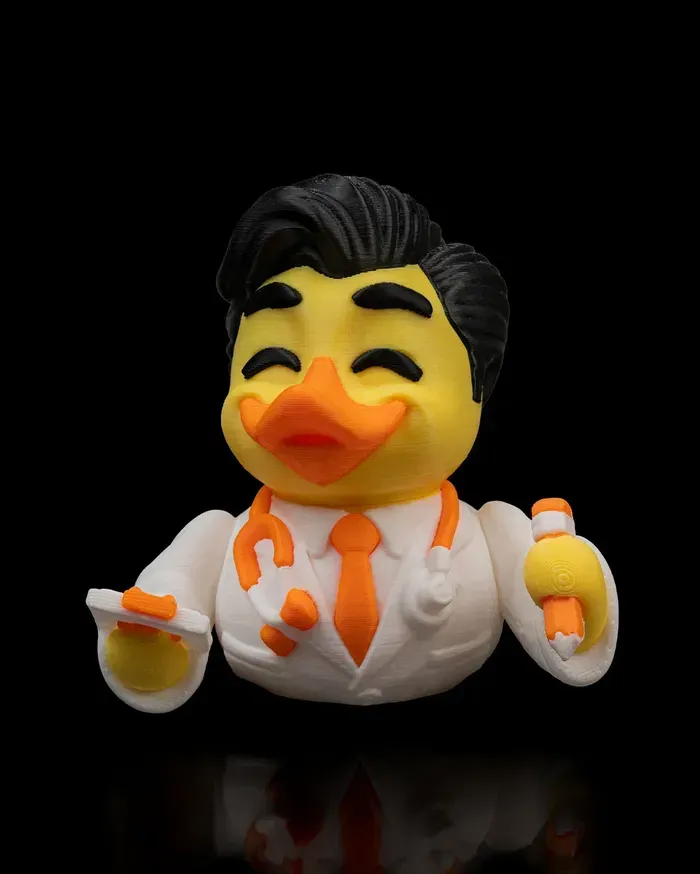 A rubber duck dressed as a doctor holding a stethoscope