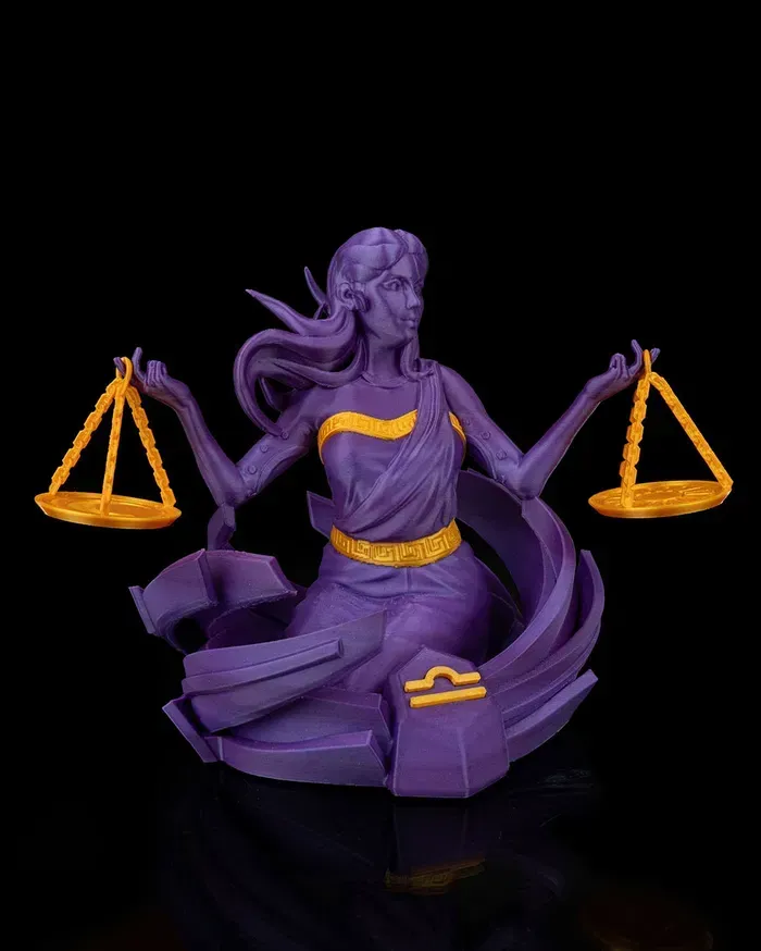 A purple statue of a woman holding scales on a black background.