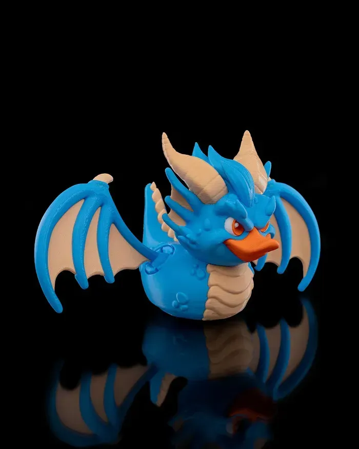 A blue rubber duck with wings and horns on a black background
