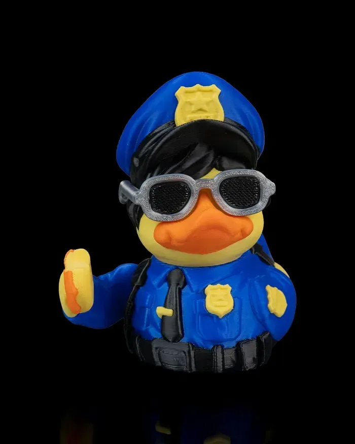 A police rubber duck wearing sunglasses and a hat