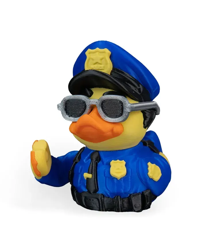 A police rubber duck wearing sunglasses and a hat
