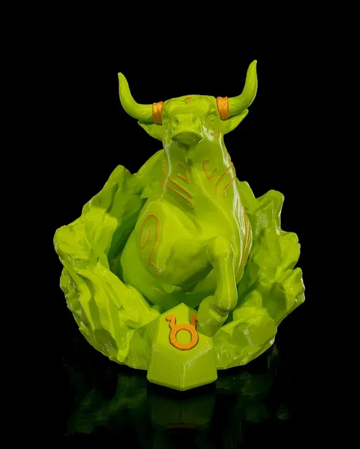 A green statue of a bull with a taurus symbol on it