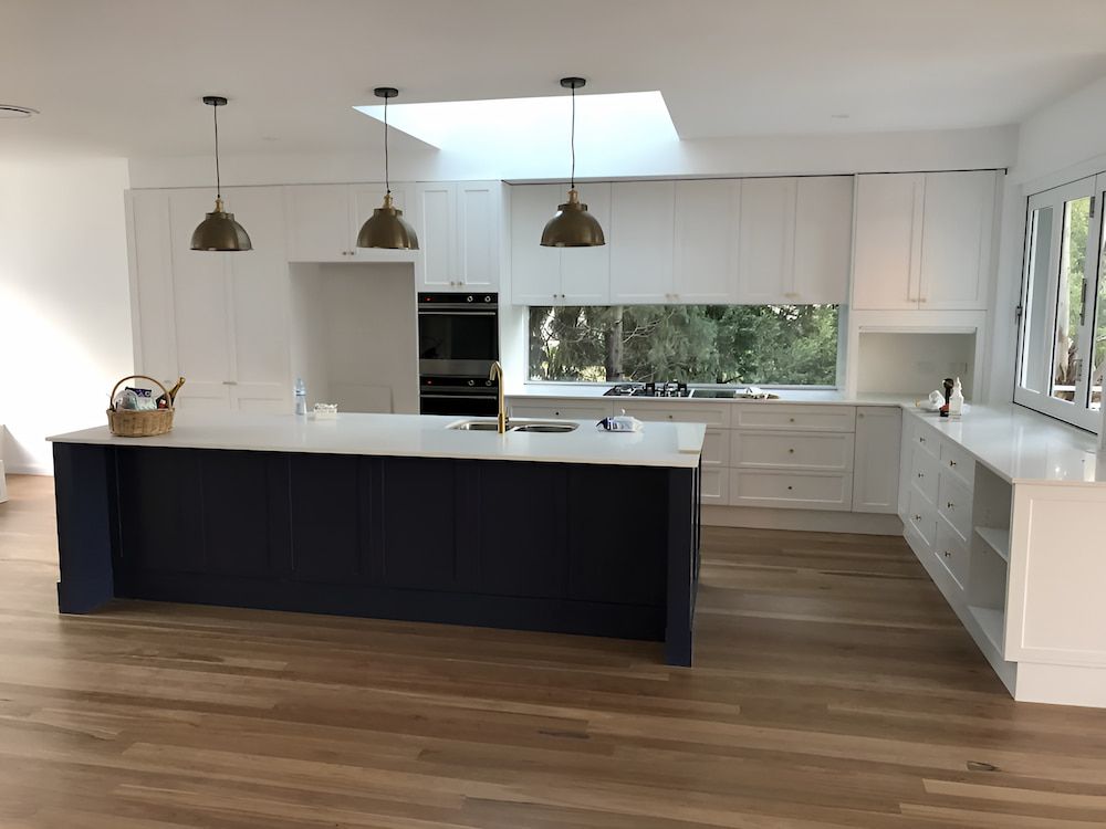 There Is A Large Island In The Middle Of The Kitchen — United Kitchens and Joinery in Oak Flats, NSW
