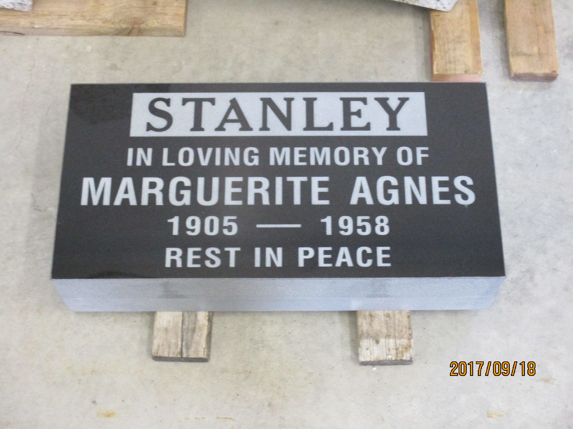 Black memorial plaque for Marguerite Agnes Stanley, 1905–1958, reading “Rest in Peace.”