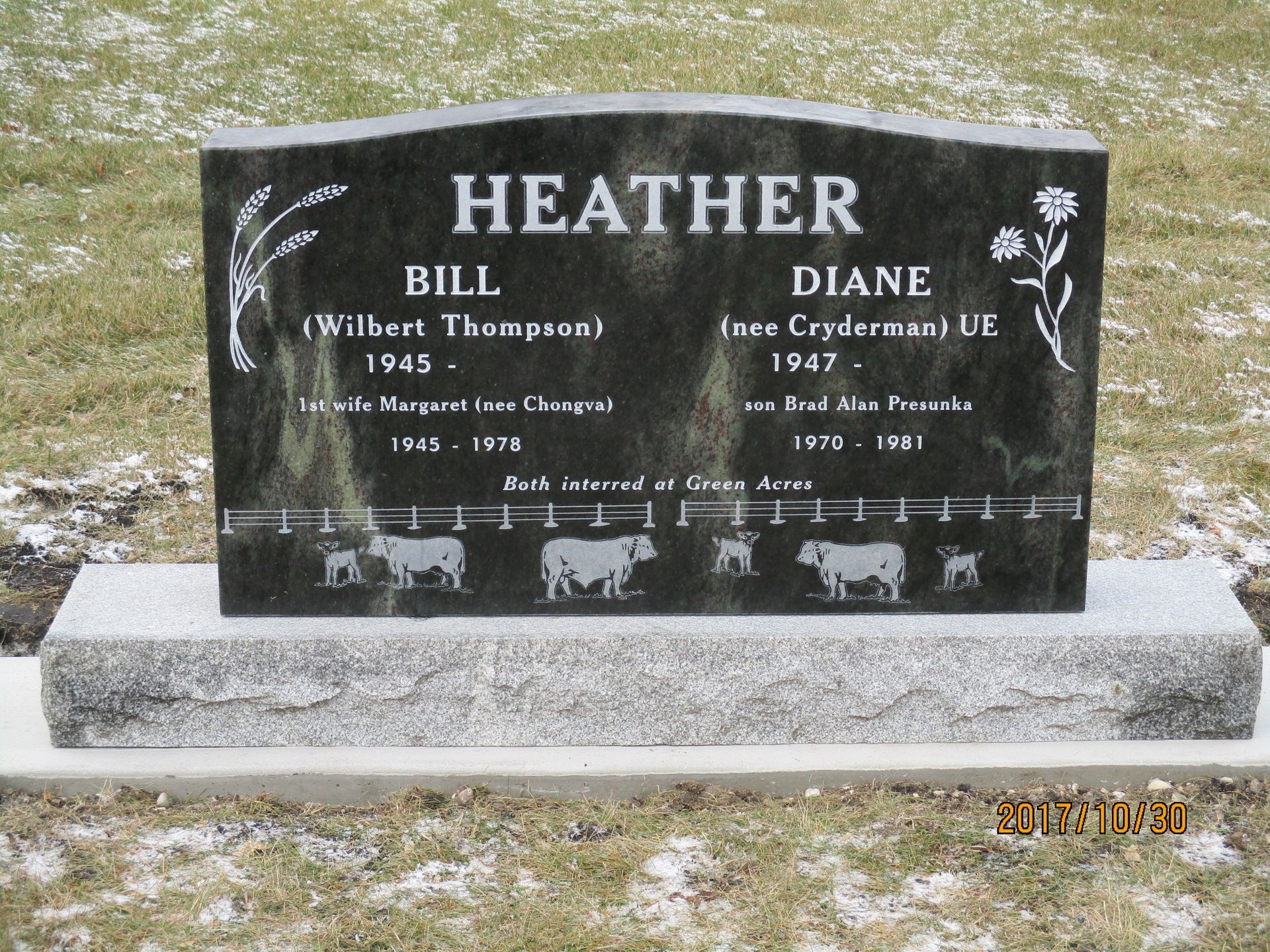 Black granite double gravestone with “HEATHER” and “Diane” engraved, set on a light stone base.