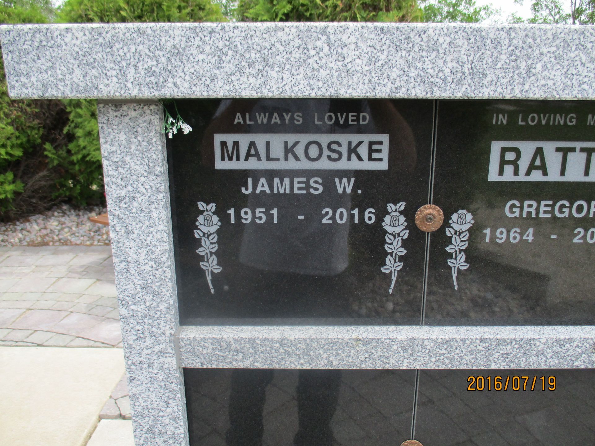 Black granite memorial bench engraved “Always Loved” for James W. Malkowski, 1951–2016.