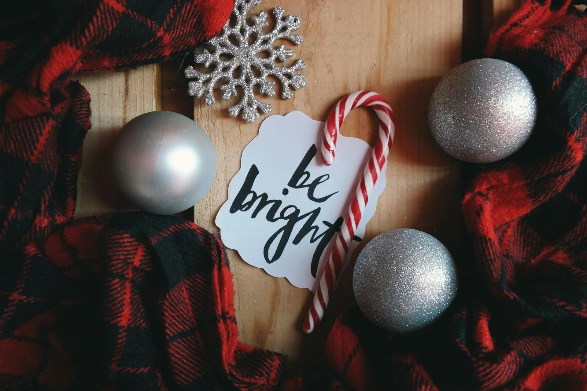 Christmas arrangement: silver ornaments, snowflake, candy cane,