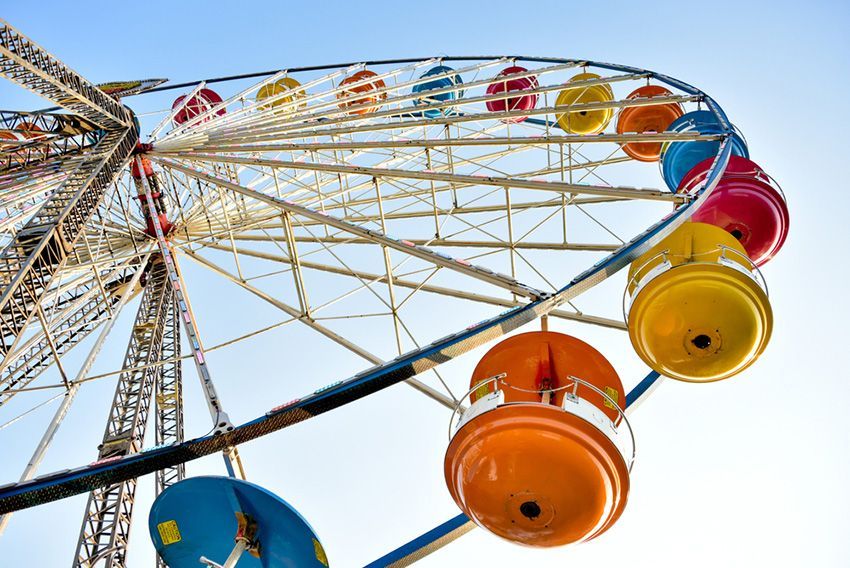 A Colourful Ferris Wheel is Against a Blue Sky — Fun Time Amusements in Mackay, QLD