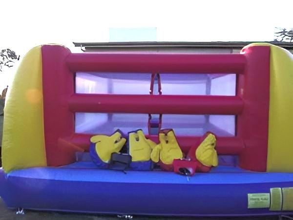 Inflatable Boxing Ring With Yellow and Red Frame, Blue Base — Fun Time Amusements in Gracemere, QLD