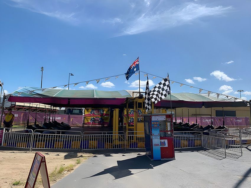 A Carnival Ride With a Checkered Flag Hanging From the Roof — Fun Time Amusements in Gracemere, QLD