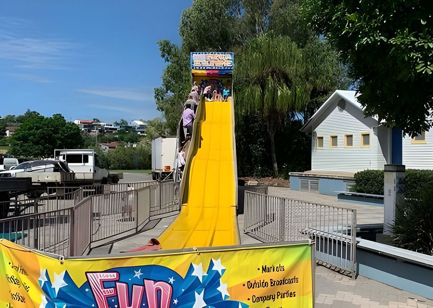 A Yellow Slide — Fun Time Amusements in Gracemere, QLD