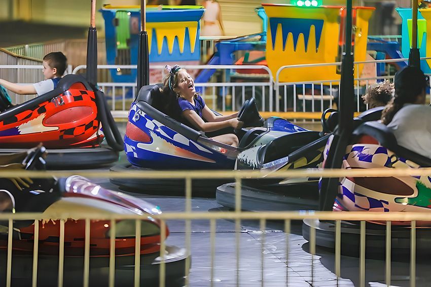 A Group of People Are Riding Bumper Cars at an Amusement Park — Fun Time Amusements in Gracemere, QLD