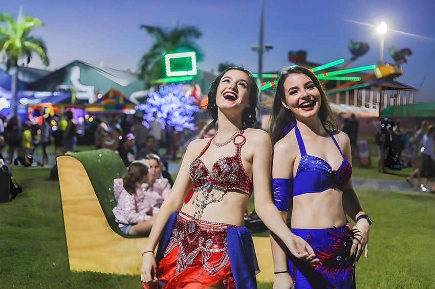 Two Girls Are Standing Next to Each Other in a Park — Fun Time Amusements in Gracemere, QLD