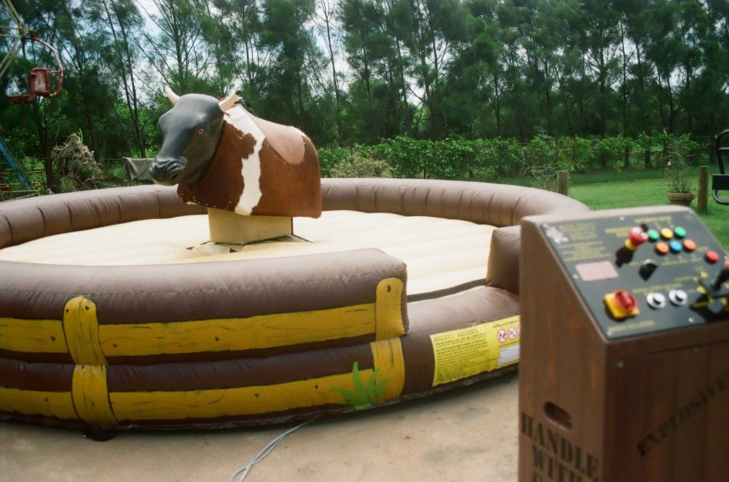 Mechanical Bull on an Inflatable Ring, With Control Panel in a Park-like Setting — Fun Time Amusements in Gracemere, QLD