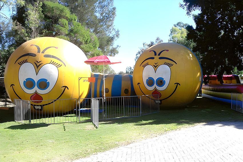 Two Smiley Faces Next to Each Other in a Park — Fun Time Amusements in Gracemere, QLD
