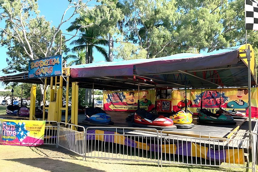 A Carnival Ride is Behind a Fence in a Park — Fun Time Amusements in Gracemere, QLD