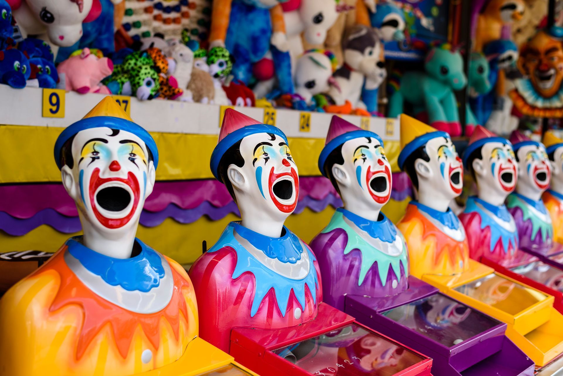 Clown Arcade Game Row, Open Mouths, Colourful, Carnival Setting — Fun Time Amusements in Gracemere, QLD