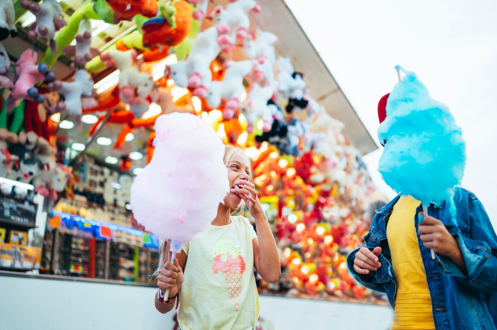 A Person is Holding a Cup of Shaved Ice With a Spoon in It — Fun Time Amusements in Biloela, QLD