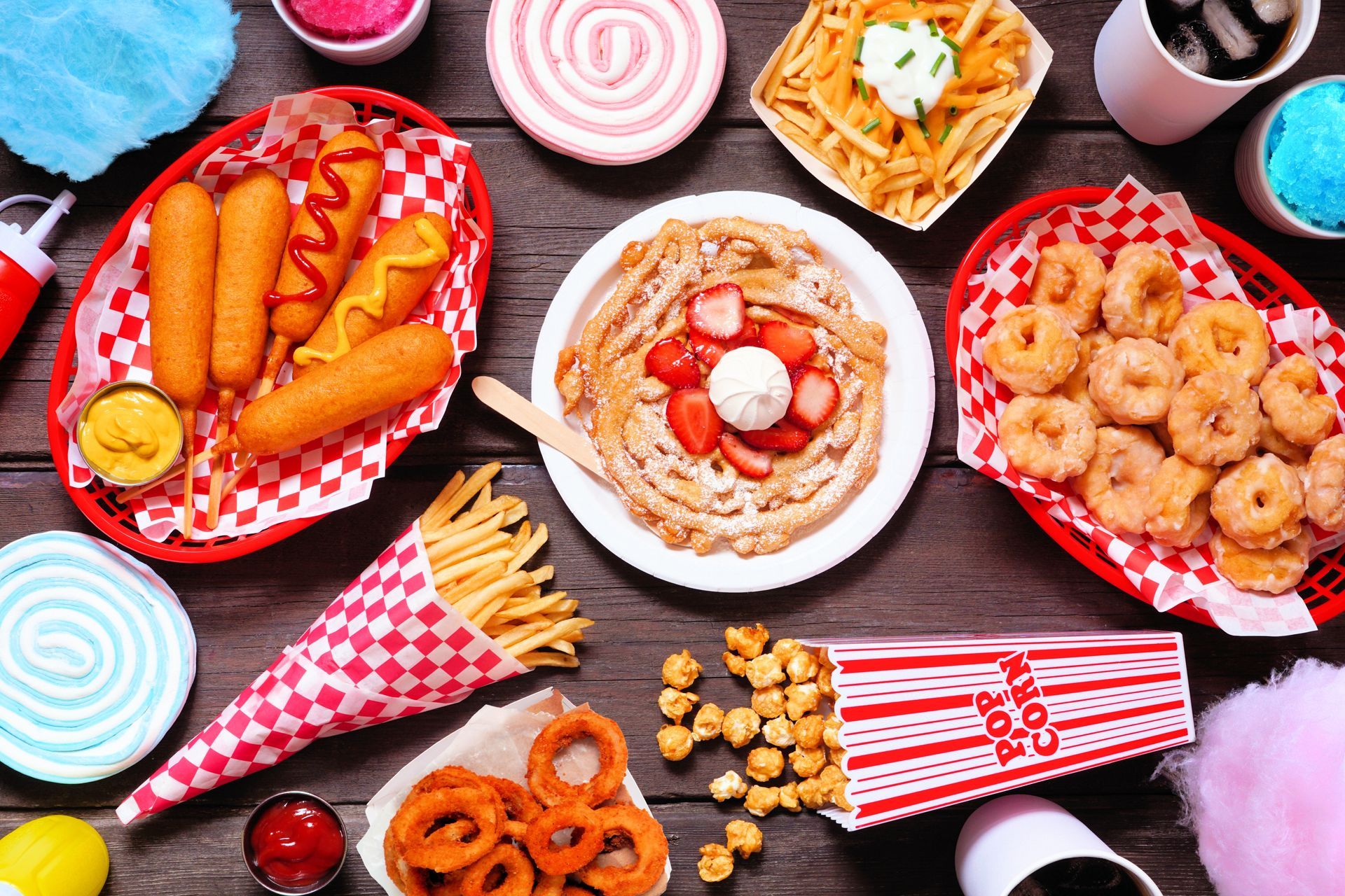 Three Striped Containers of Popcorn Are on a Table — Fun Time Amusements in Mackay, QLD