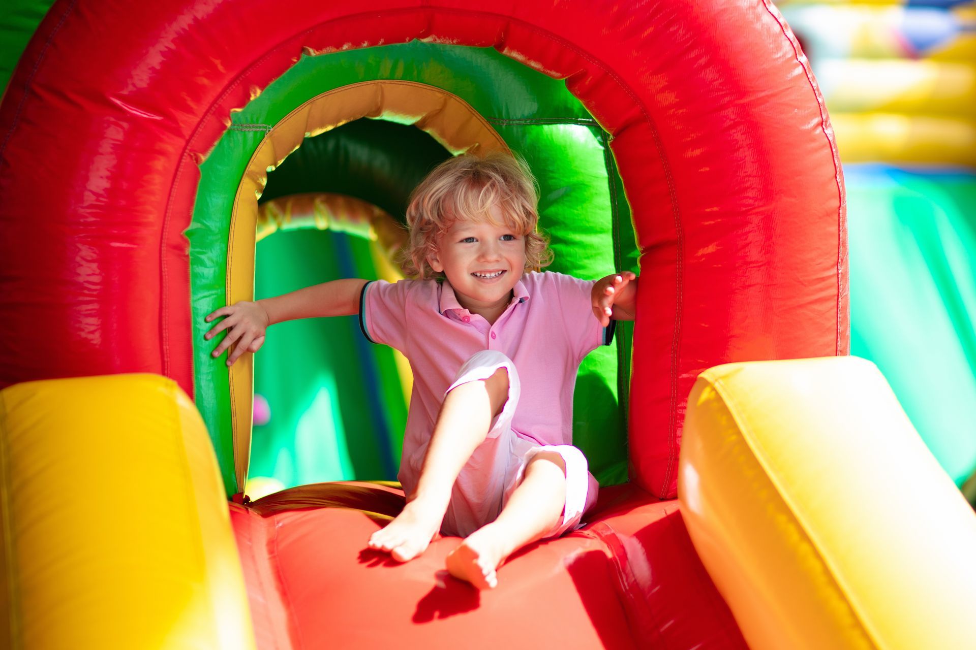 A Little Girl is Jumping in a Bouncy House — Fun Time Amusements in Bundaberg, QLD