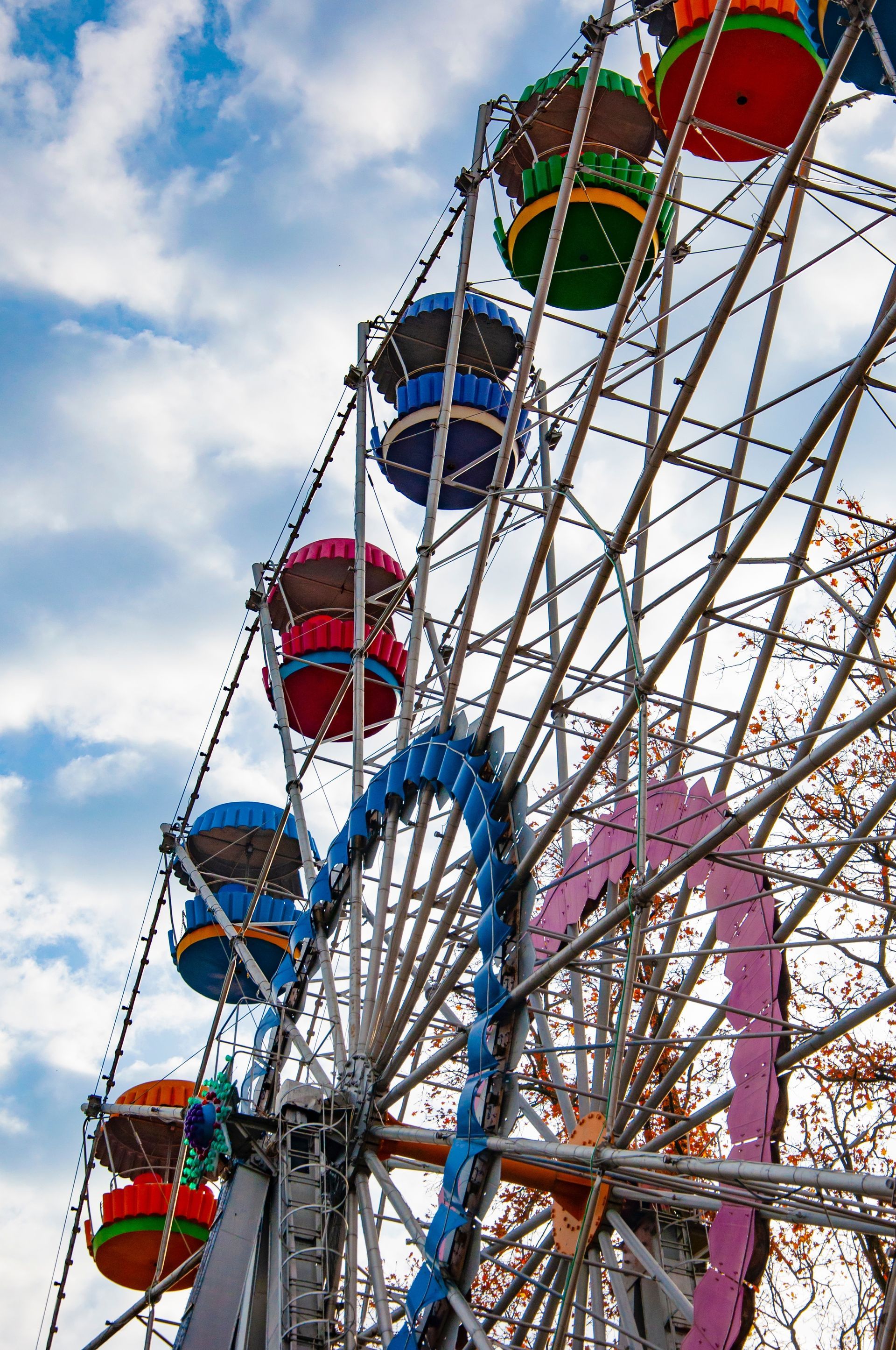 A Trampoline is Behind a Fence in a Park — Fun Time Amusements in Bundaberg, QLD