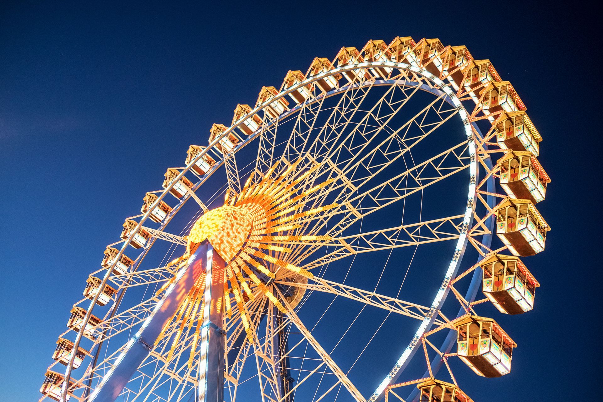 A Ferris Wheel With Blue and Orange Colors — Fun Time Amusements in Yeppoon, QLD