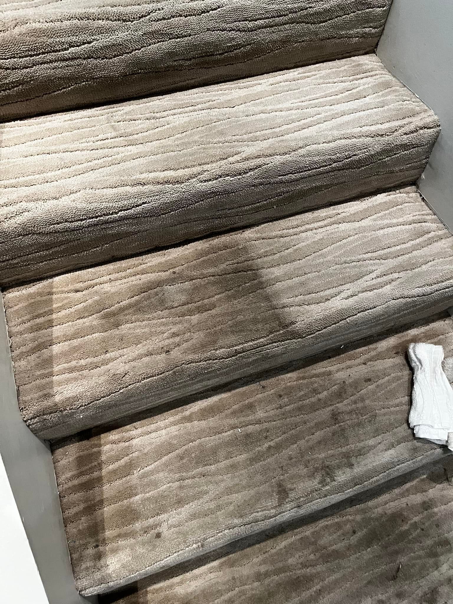 Carpet Master of Tulsa - A close up of a staircase with a carpet on it.
