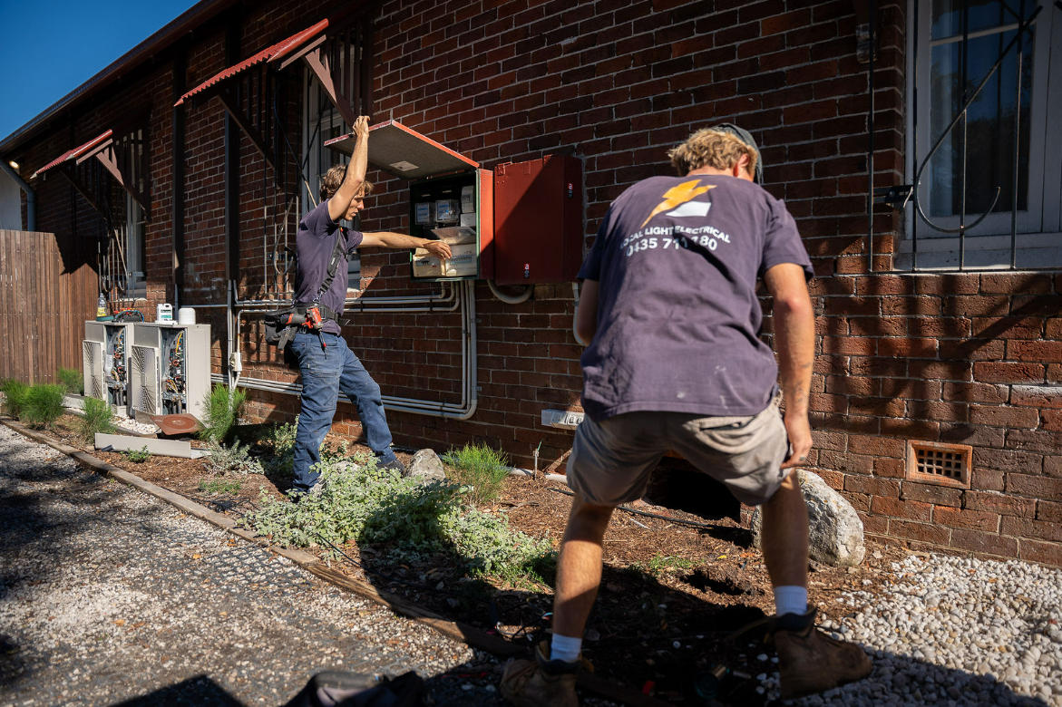 Two Workers Fixing Electricity System of A House — Local Light Electrical in Alstonville, NSW