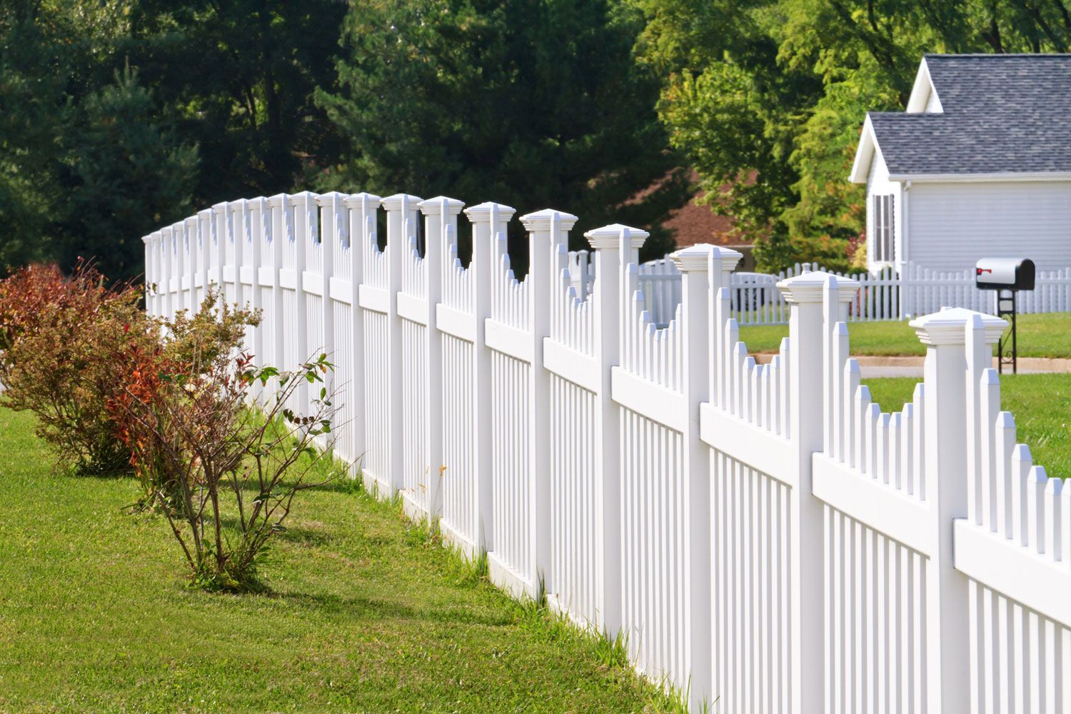 White vinyl residential fence installation in Cedar Rapids, IA's neighborhood by Corridor Residential Fencing Co. White vinyl residential fence installation in Cedar Rapids, IA's neighborhood by Corridor Residential Fencing Co.