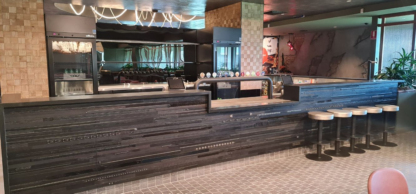 A Restaurant With A Long Counter And Stools — Logic Joinery In Fountaindale, NSW