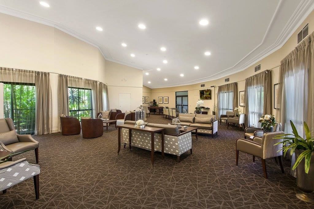 A Large Living Room Filled With Furniture And A Piano — Logic Joinery In Fountaindale, NSW