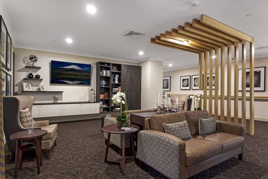 A Living Room With Tables And A Television — Logic Joinery In Fountaindale, NSW